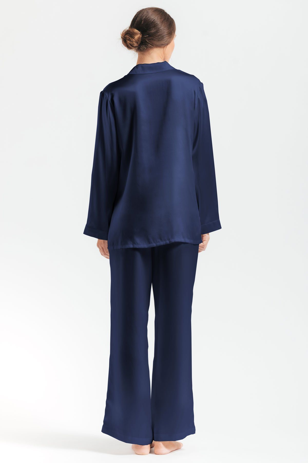 Backview of model wearing Morgan Silk pajama set in evening-blue