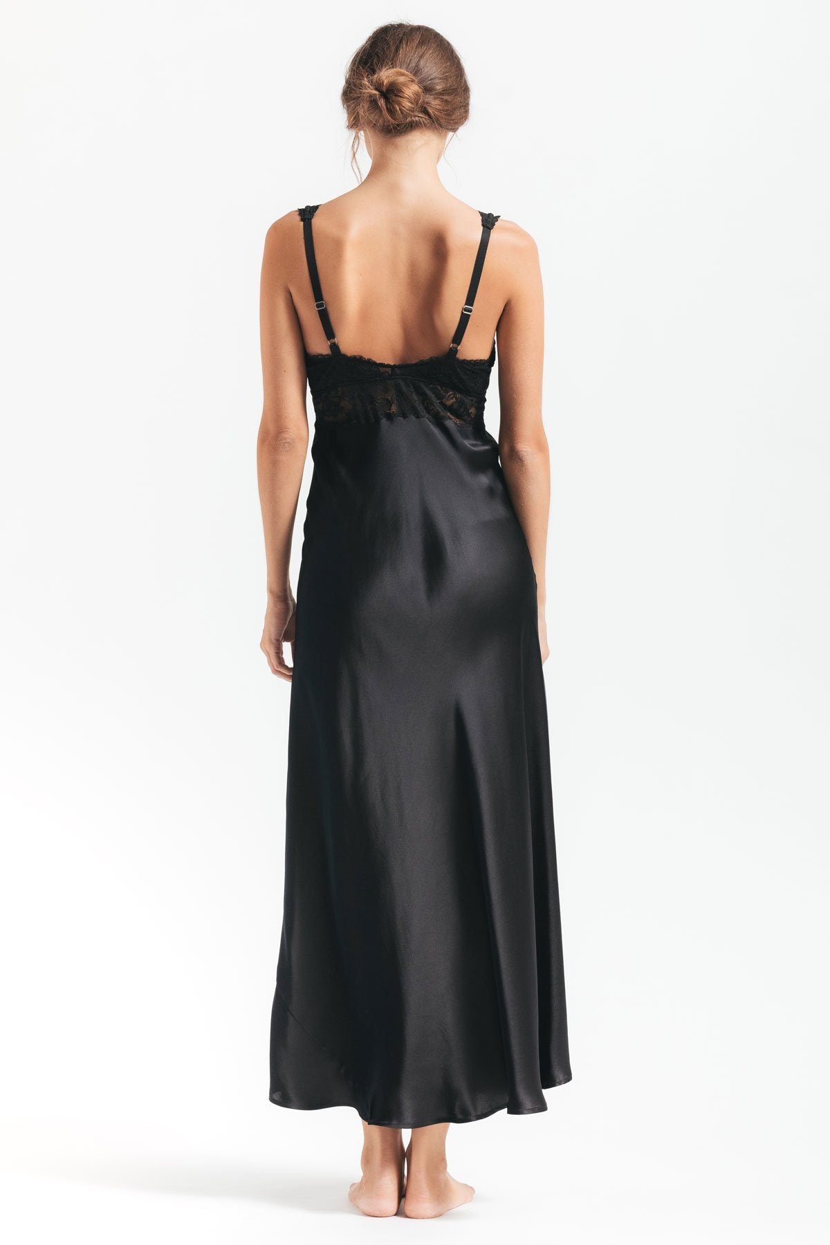 Back profile of model wearing Morgan iconic Bust-support black silk gown
