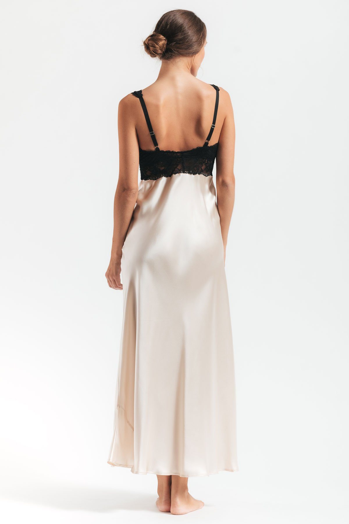 Backview of model wearing Morgan Iconic Bust-Support silk gown in champagne
