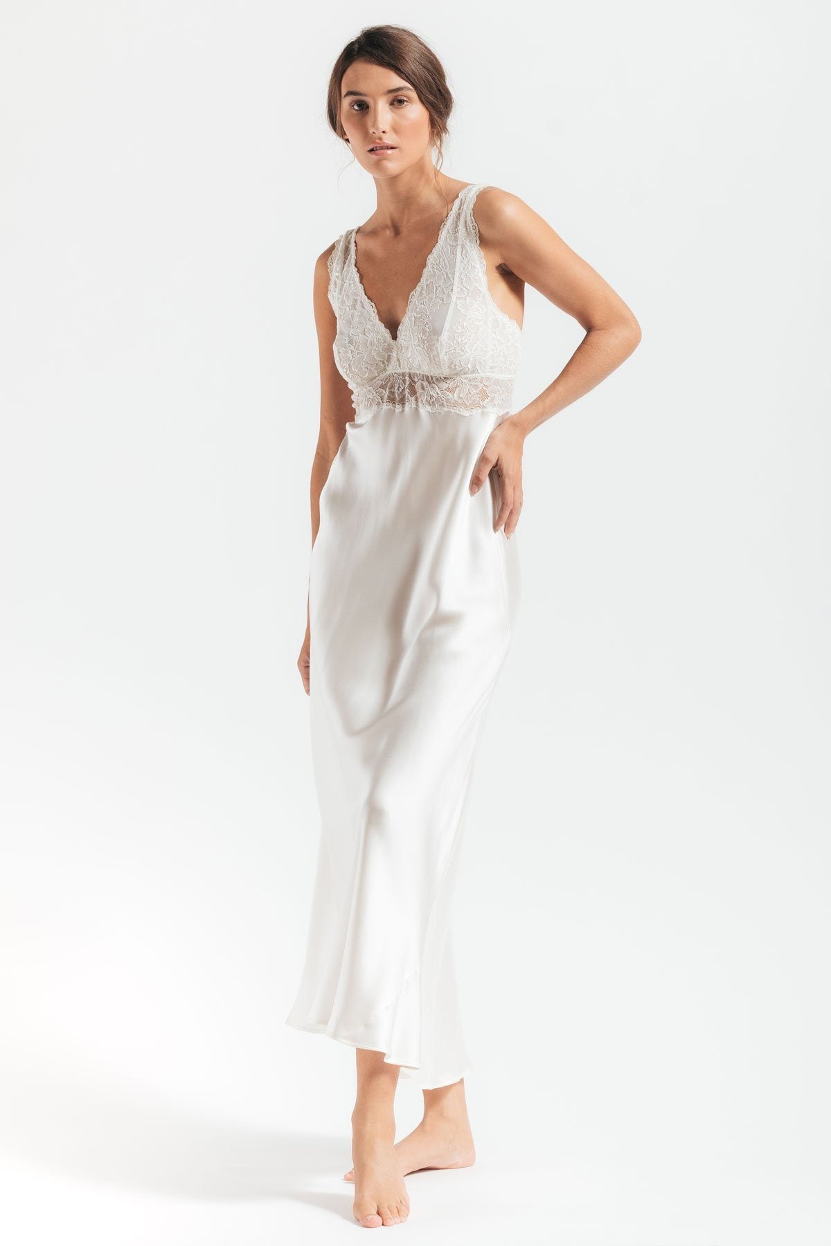 Model wearing Morgan Iconic Bust-Support white silk gown in Ivory