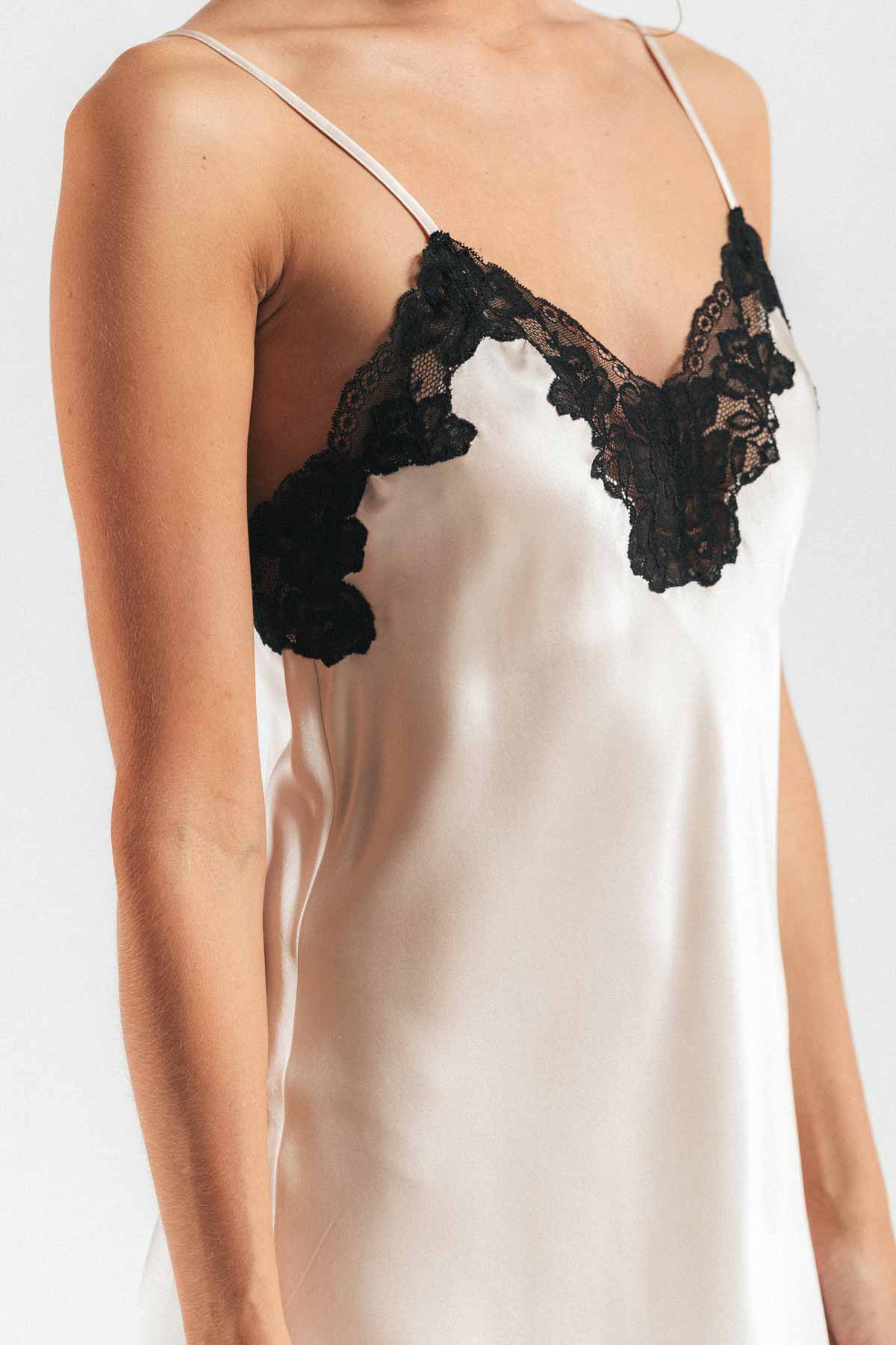 Close up of front of model wearing Morgan lace sphaghetti women's silk camisole in champagne