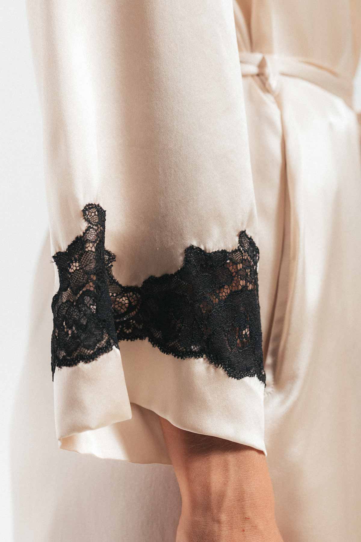 Close up of lace sleeve on Morgan Long silk robe in champagne