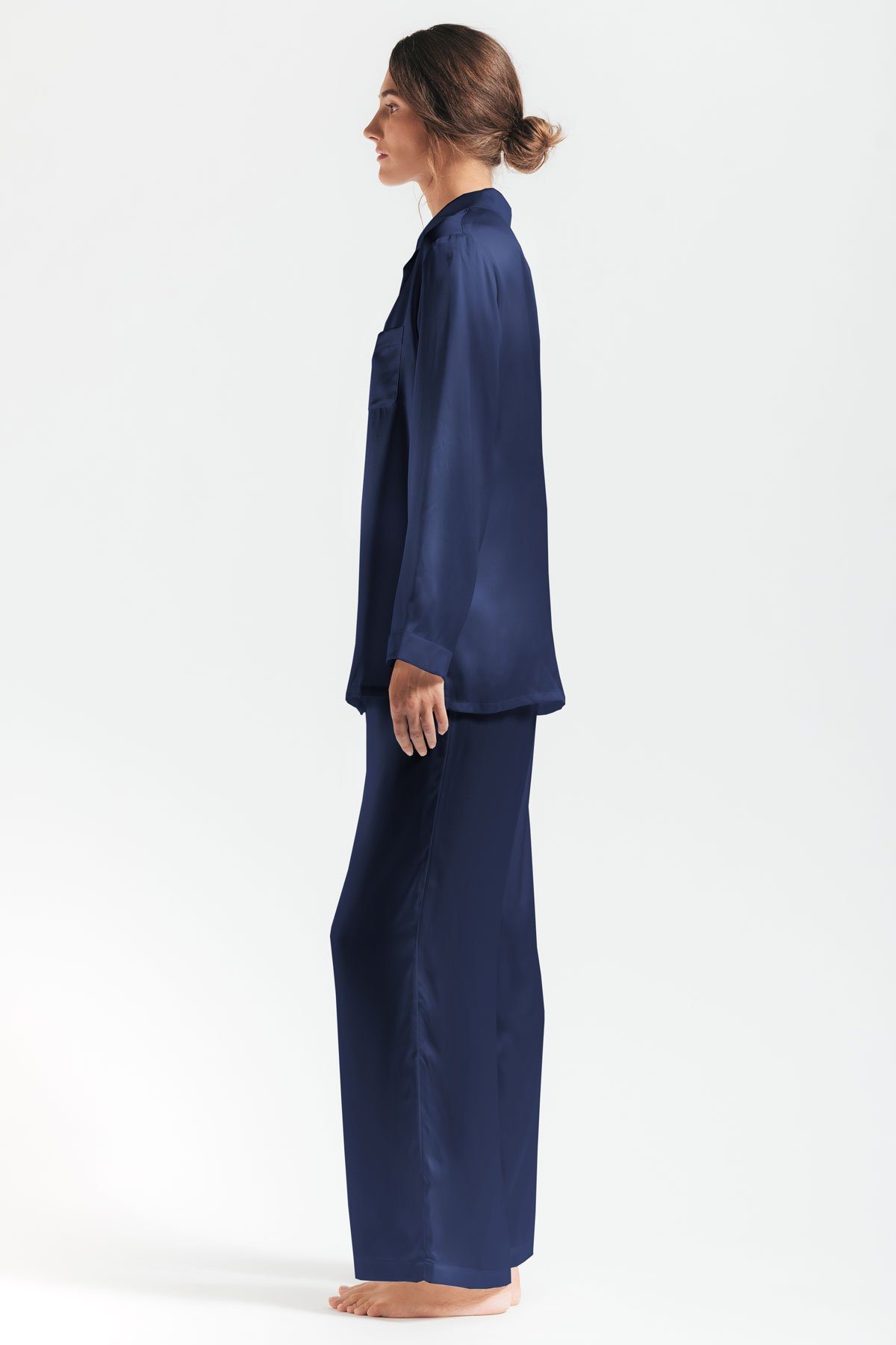 Sideview of model wearing Morgan womens silk pajama set in evening-blue