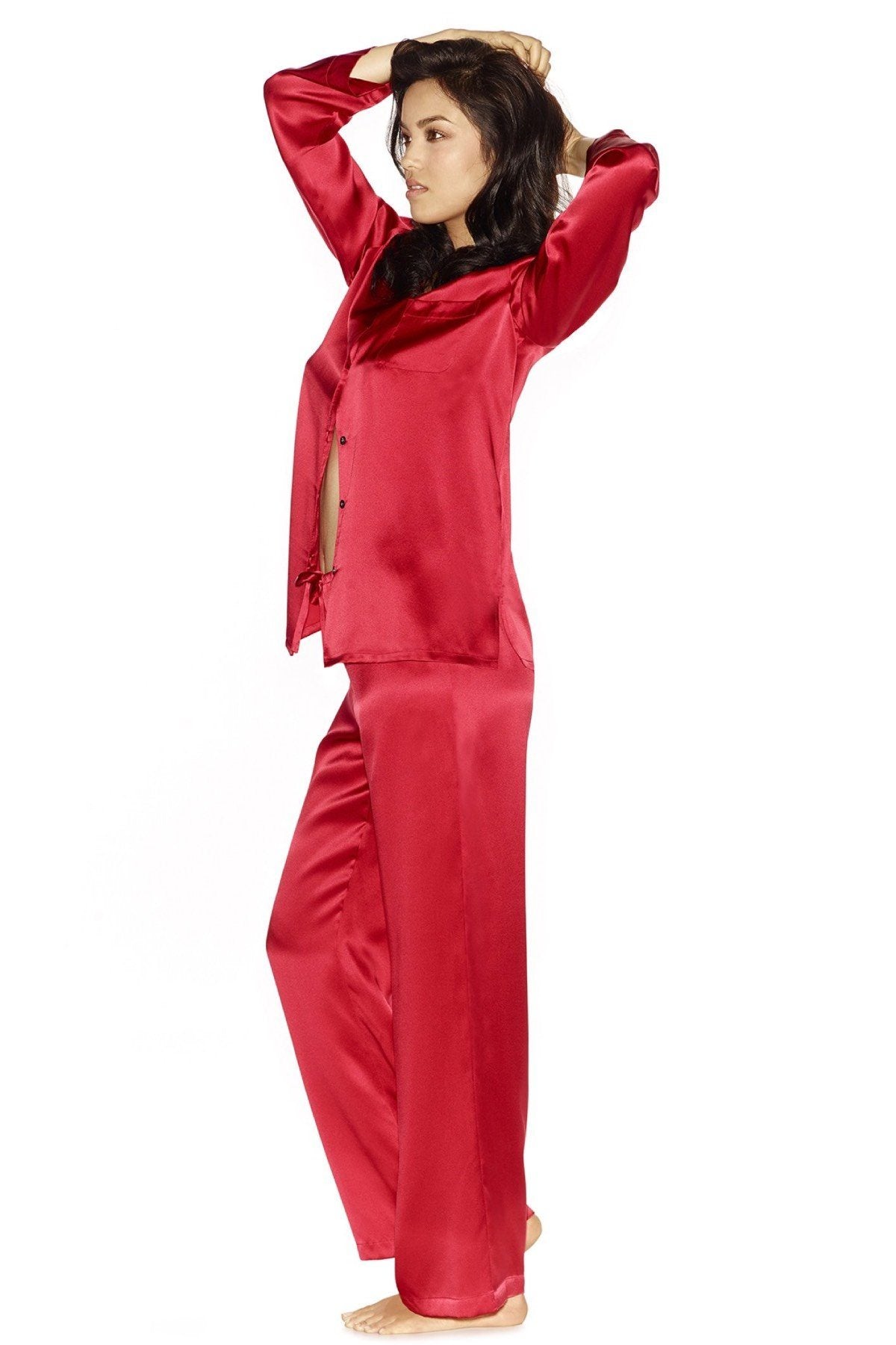 Model standing sideways wearing Morgan silk pajama set in scarlet