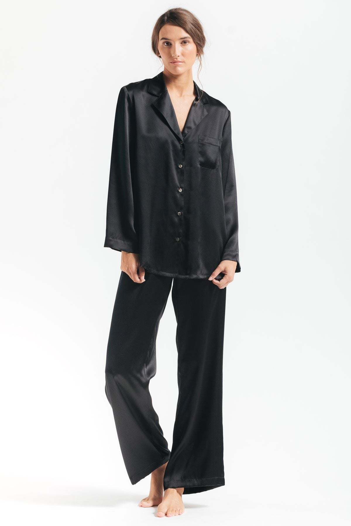 Model wearing Morgan silk pajama set in black 