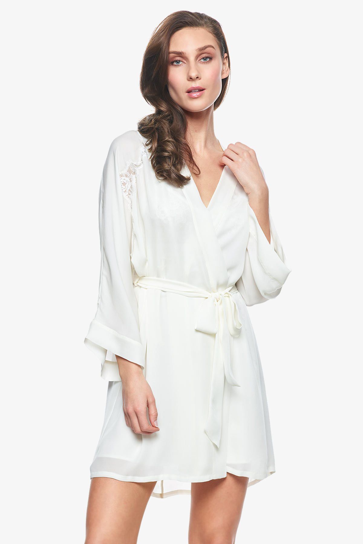 Model showcasing Sigrid short bridal robes in pearl-white