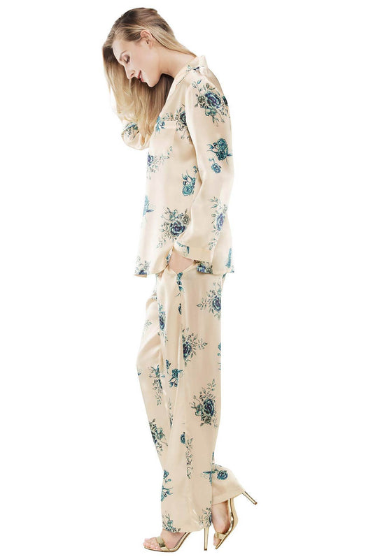 Sideview of model wearing Wild Rose Posh silk floral pajama set in wild-rose
